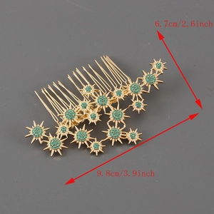 Elegant gold seven-tooth hair comb with green rhinestones and starburst floral design