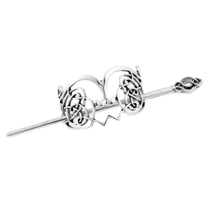 Close-up of vintage silver alloy Celtic knot hair slide and matching hairpin set