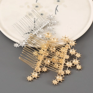 Detail of elegant gold and silver metal hair combs with star-shaped floral relief accents