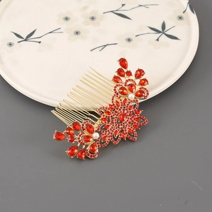 Elegant floral gold hair comb with red rhinestones and pearls for bridal hairstyles