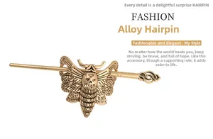 Detail of gothic moth and skull bronze alloy hair stick featuring vintage relief textures
