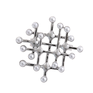 Vintage palace style silver hollow brooch with white pearls in a geometric mesh design