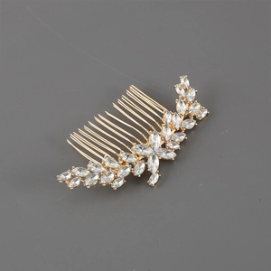 Detail of gold floral hair comb with marquise cut crystals for elegant wedding styles