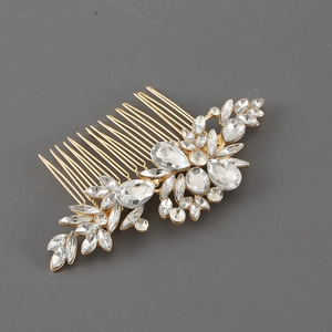 Detailed view of vintage alloy hair comb with sparkling crystals and leaf design