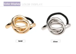 Close-up of gold and silver metallic knot ornaments on elastic hair scrunchies