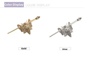 Detail view of gothic moth skull hair pins in polished gold and silver finishes