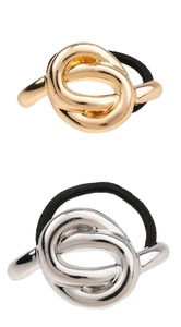 Detail of minimalist gold and silver irregular alloy metal knot elastic hair ties