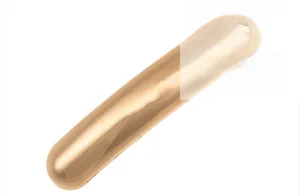 Detailed macro view of the sleek gold-plated cylindrical alloy hair clip with mirror finish