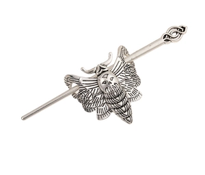 Detailed view of gothic silver moth hair pin with skull carving and vintage textures
