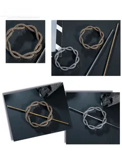 Detail of gold and silver alloy hair pins with intricate woven texture on circular rings
