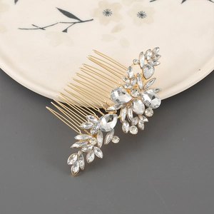 Detailed macro view of vintage gold leaf hair comb with sparkling clear rhinestones