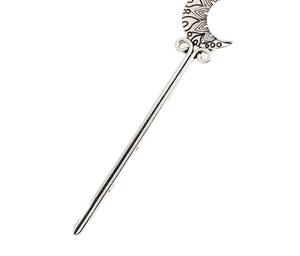 Macro detail of crescent moon hair stick with vintage mandala patterns in silver finish
