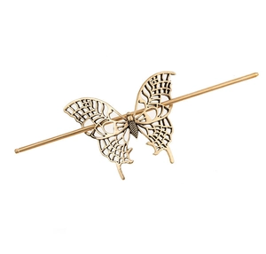 Detailed macro view of retro hollow butterfly hair pin with antique gold finish