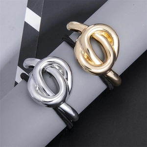 Minimalist knot design hair ties in polished gold and silver metal alloy finishes