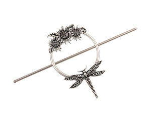 Detailed view of vintage silver sunflower hair fork set with dragonfly and hollow circle