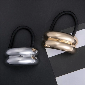 Minimalist geometric metal hair ties in silver and gold with high-elastic black ropes