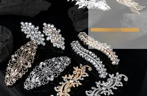 Detailed close-up of vintage alloy hair clips with sparkling crystals and floral motifs