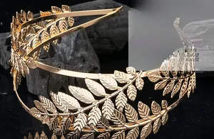 Close-up of golden alloy laurel leaf headband showing intricate leaf vein textures