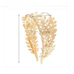 Detailed view of the golden leaf headband showing fine metallic texture and dimensions