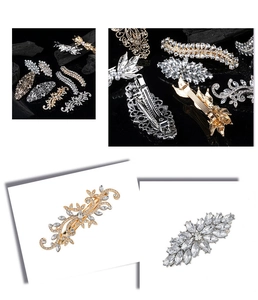 Detailed views of vintage alloy hair clips set with rhinestones and floral designs