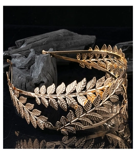 Detail shot of golden double-layer laurel leaf headband with metallic luster texture