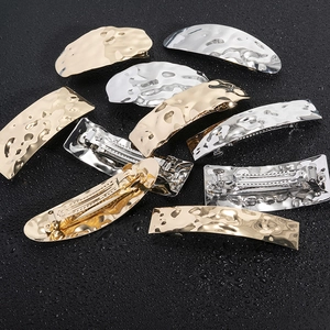 Irregular hammered geometric metal hair clips in gold and silver with spring back closure