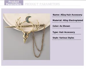 Detail view of antler moon hair stick with vintage metallic tassels and bird skull charm