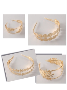 Detail of double-layer golden alloy headbands with leaf, star and coin charms