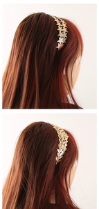Detail view of gold alloy headbands showing star and laurel leaf patterns on brown hair
