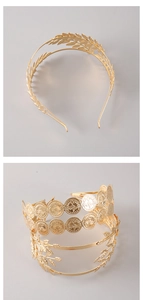 Close-up of golden metal headbands with double-layer laurel leaf and coin designs