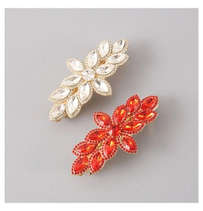 Detailed close-up of crystal flower hair clips with gold alloy base and sparkling rhinestones