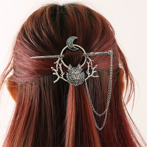 Gothic wolf head hair stick with moon shell inlay and silver tassel on red hair