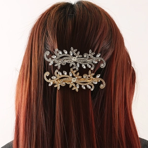 Sparkling crystal leaf hair clips in gold and silver finish for elegant hairstyles