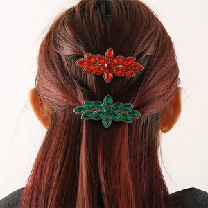Luxurious crystal flower hair clips in ruby red and emerald green with vintage gold finish