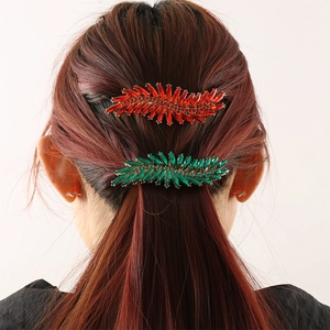 Sparkling crystal feather hair clips with ruby and emerald gems for elegant hairstyles