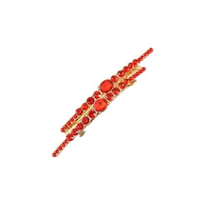 Elegant gold-tone hair clip with sparkling red crystals and rhinestones on white base