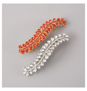 Detail of leaf-shaped rhinestone hair clips with colorful crystals and alloy spring clips
