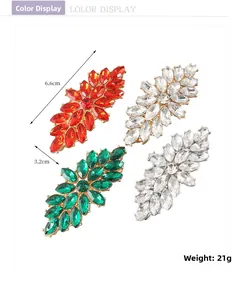 Detailed close-up of four luxury rhinestone hair clips with colorful petal-shaped crystals