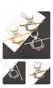 Detailed close-up of branch and moon hair pins with turquoise stone in three metal finishes