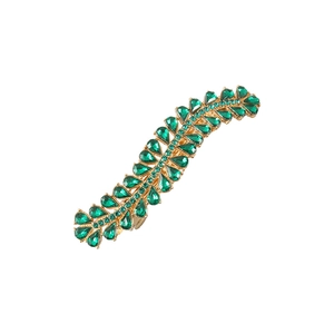 Elegant gold leaf hair clip with dark green rhinestones on white background