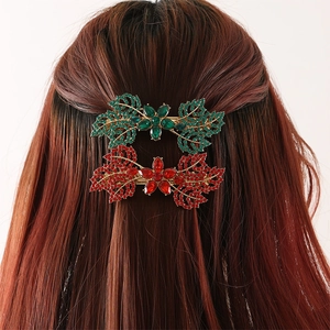 Sparkling leaf-shaped hair clips with green and red rhinestones on a gold alloy base