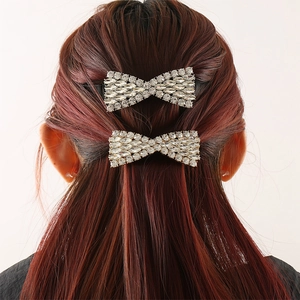 Elegant rhinestone bow hair clip set shown on model for a minimalist hair accessory look