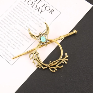 Retro gold hair pin set with crescent moon and turquoise stone on a branch design