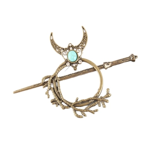 Vintage bronze hair pin set featuring a crescent moon and branch design with turquoise stone
