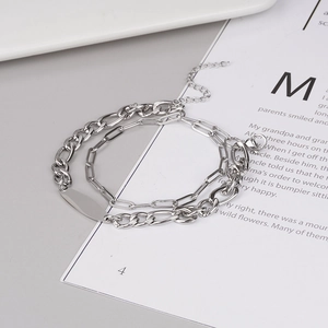 Bracelet double couche en acier inoxydable avec plaque ovale et chaîne trombone chic