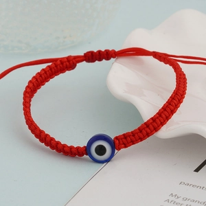 Handmade red braided turtle eye bracelet with evil eye beads and adjustable cord