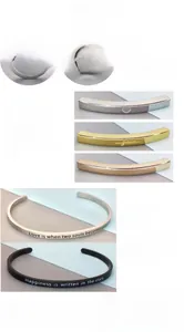 Detail view of custom laser engraving and polished finishes on stainless steel bracelets