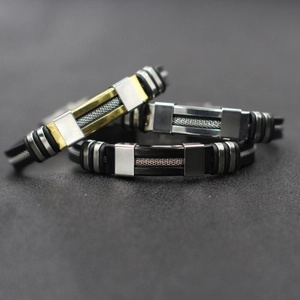 Three men's industrial stainless steel mesh bracelets in gold, silver, and black colors