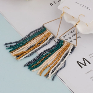 Bohemian seed bead tassel earrings with golden triangular frame and colorful fringe