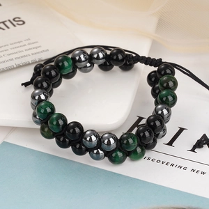 Close-up of 8mm tiger eye, obsidian and hematite beads on a hand-woven double layer bracelet